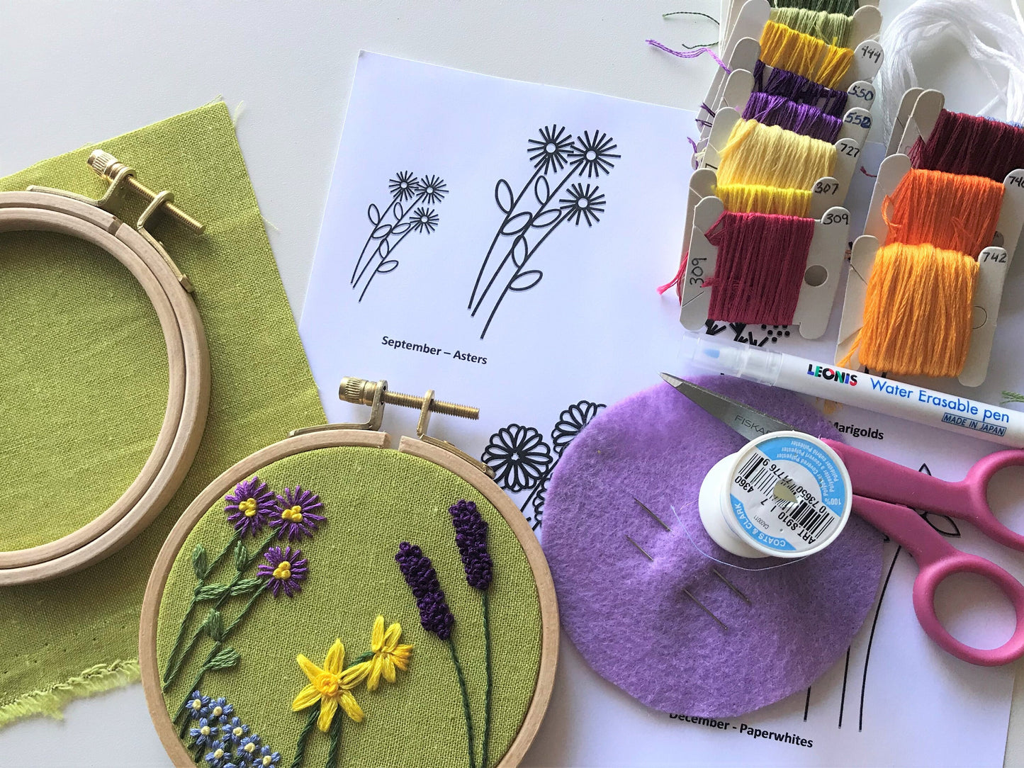 You will need hoop, fabric, water transfer marker, embroidery thread, scissors, and needle. Two sizes of flowers are printed for every month. Design to fit your recipient.
