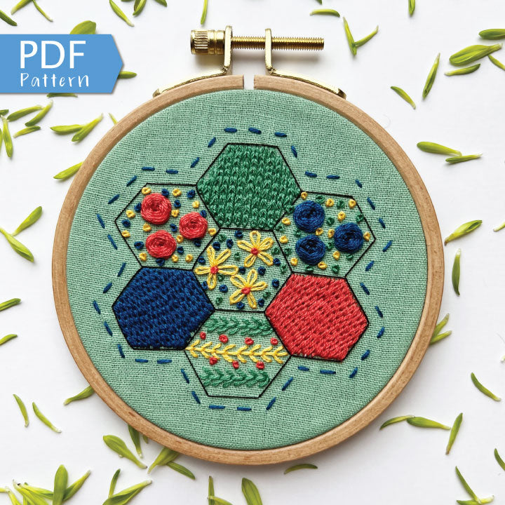 Rosanna Diggs Embroidery Hexie Harmony PDF.  Design features a modern take on the traditional paper pieced hexagon quilt pattern.  Learn new stitches while making something beautiful. PDF includes pattern and 12 pages of easy to follow directions.