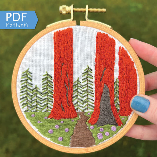 Sequoia Grove PDF. Three tall Sequoias rise from the base of the embroidery with a small trail between them. PDF includes pattern for image transfer and 11 page booklet with easy to follow directions.