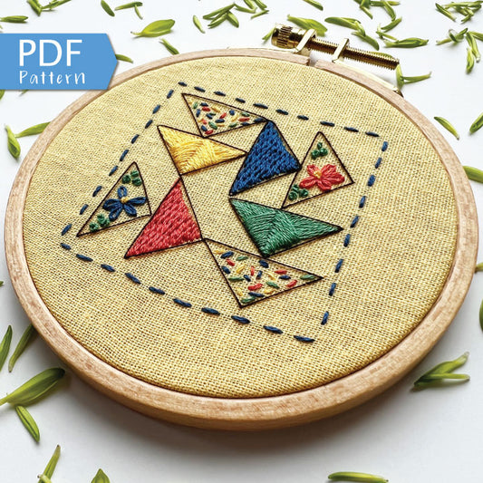 Rosanna Diggs Embroidery Triangle Tango PDF.  Design features a modern take on the traditional flying geese quit pattern.  Learn new stitches while making something beautiful. PDF includes pattern and 12 pages of easy to follow directions.