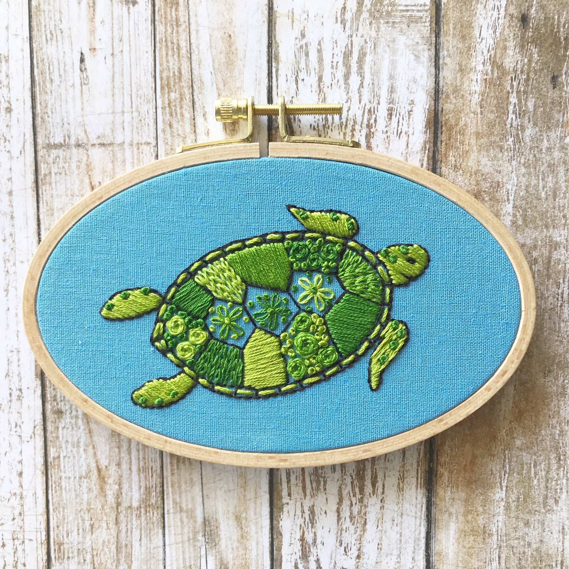 Green Sea Turtle Hand Embroidery PDF.  12 page booklet gives clear directions to complete this modern sampler with 7 different stitches.  Create your own masterpiece. Turtle with 13 shell sections with different stitch types.