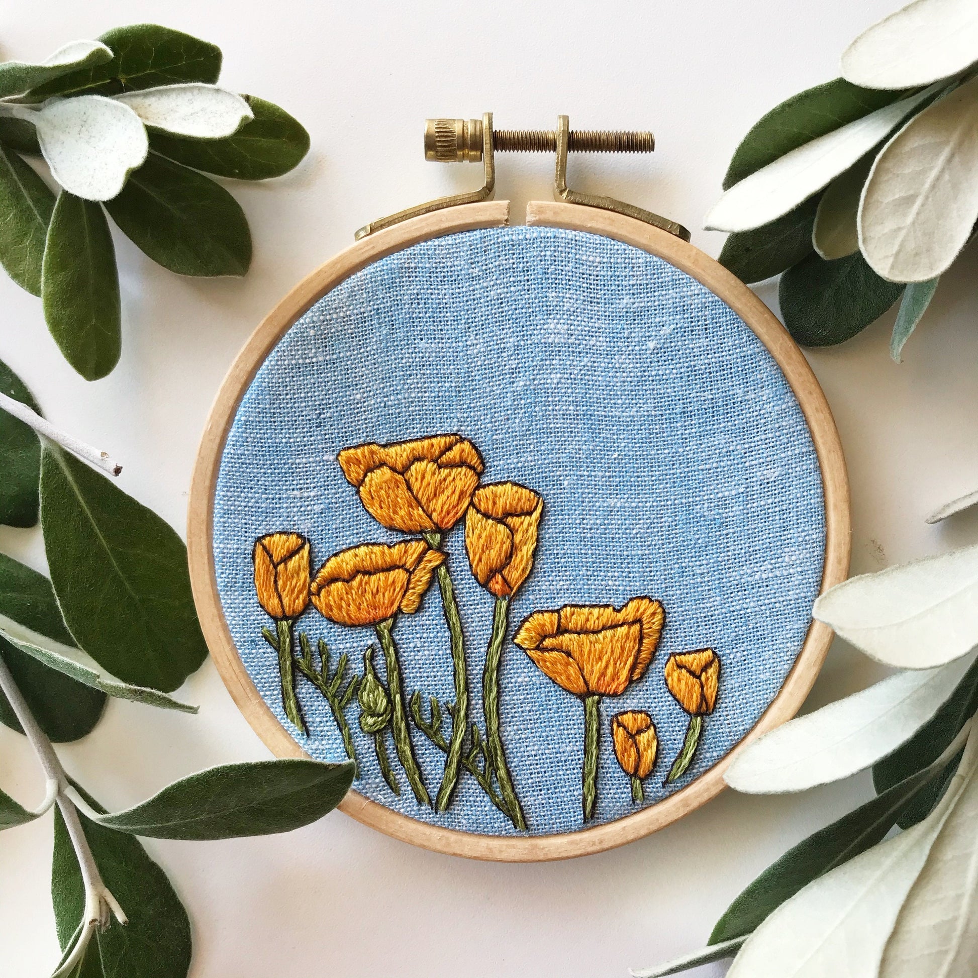 Peaceful Poppies Hand Embroidery PDF. PDF includes 10 pages of easy to follow directions that walk you through stitching seven poppies with detailed stems.