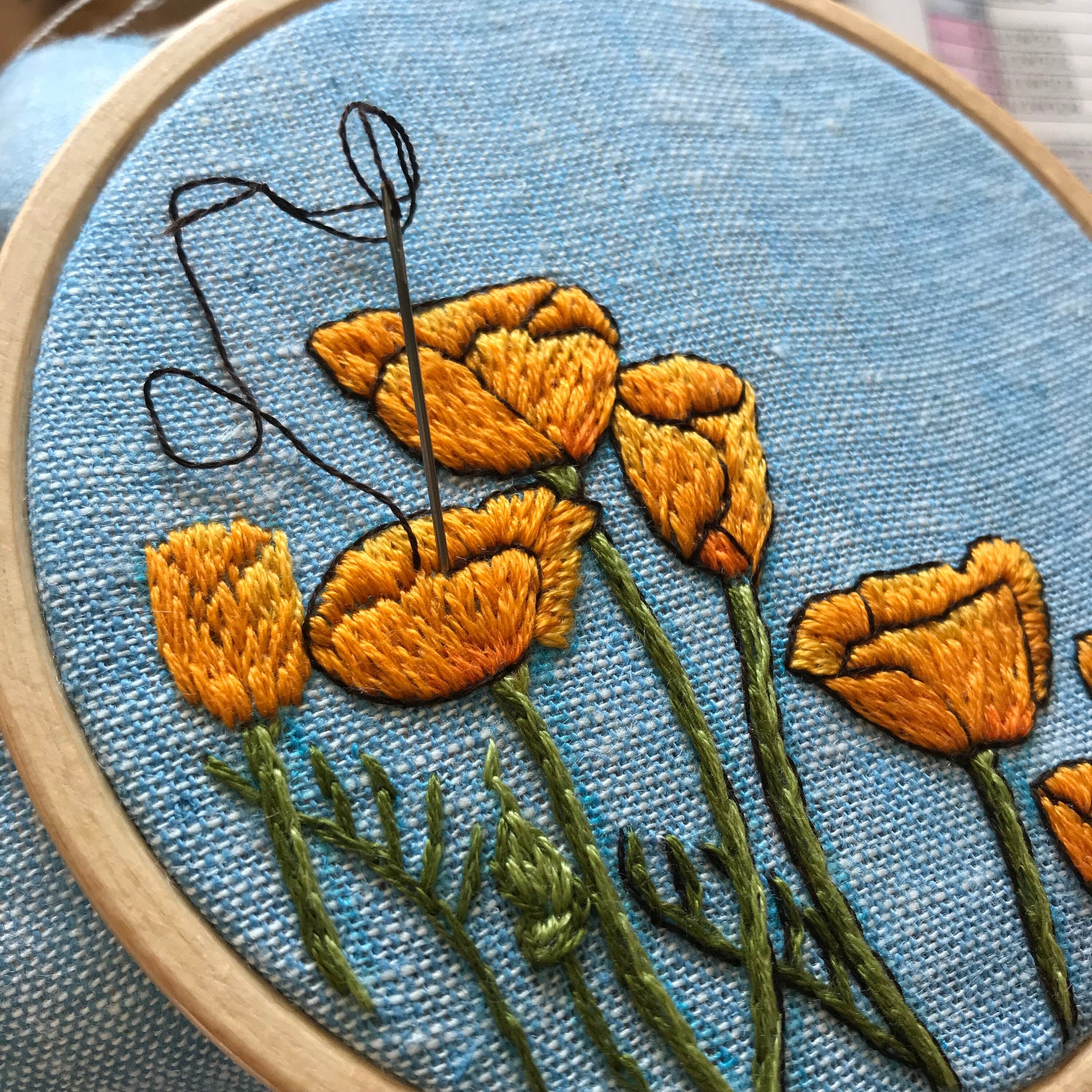 Peaceful Poppies Hand Embroidery PDF. PDF includes 10 pages of easy to follow directions that walk you through stitching seven poppies with detailed stems.