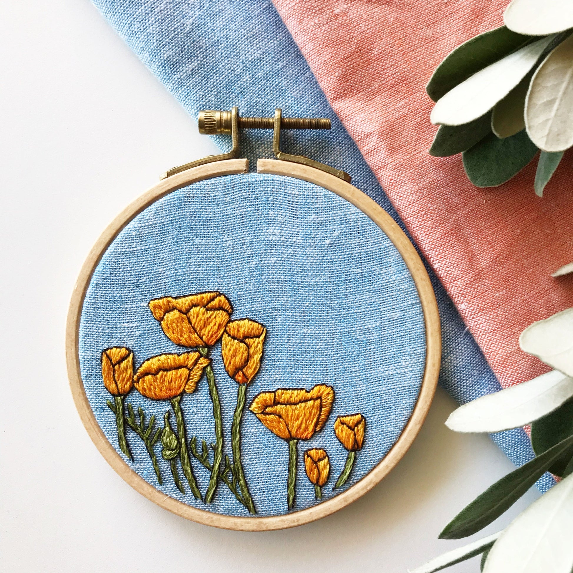 Peaceful Poppies Hand Embroidery PDF. PDF includes 10 pages of easy to follow directions that walk you through stitching seven poppies with detailed stems.