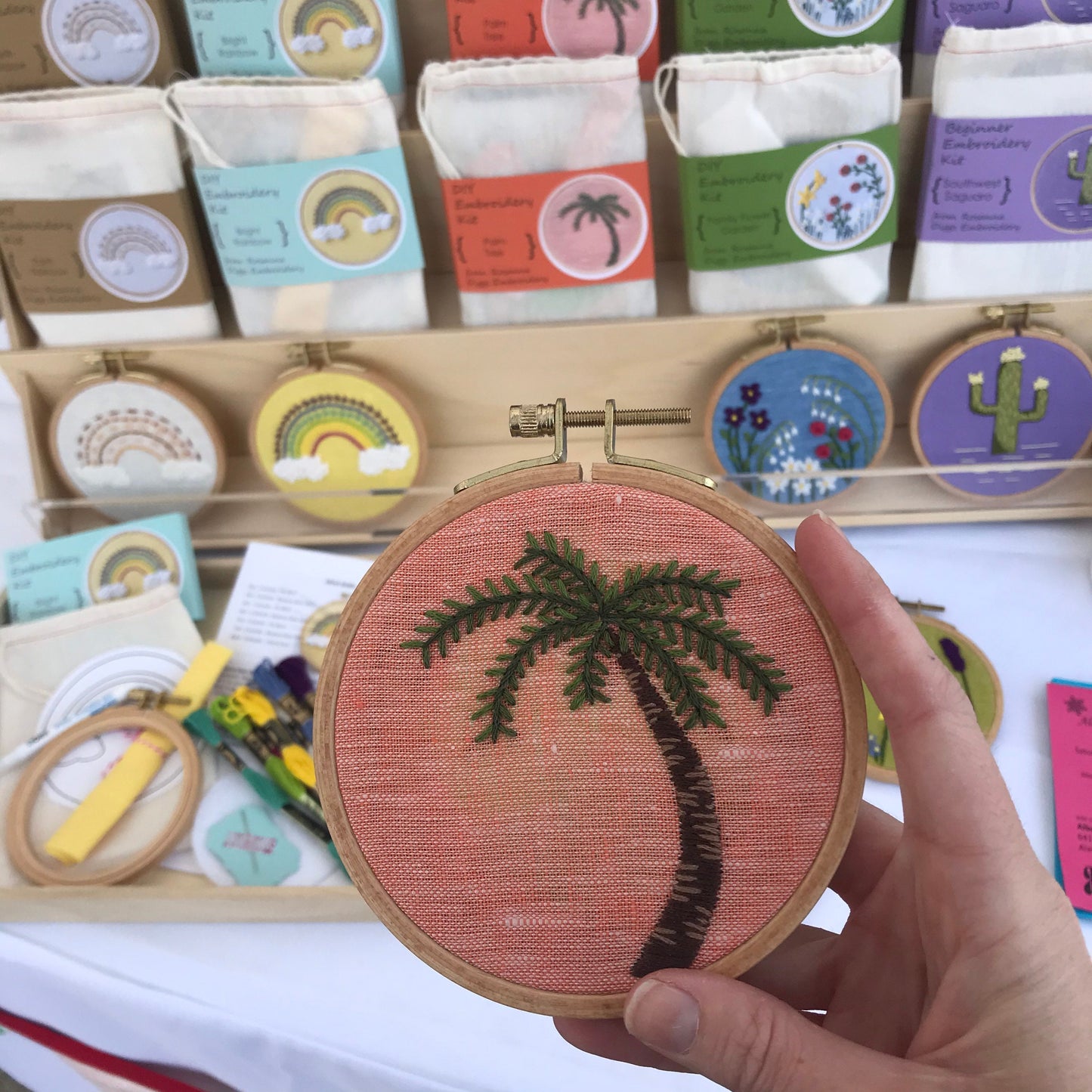 Palm Tree Hand Embroidery PDF. Detailed colorwork highlights the bark of a palm tree with multicolored palm fronds.
