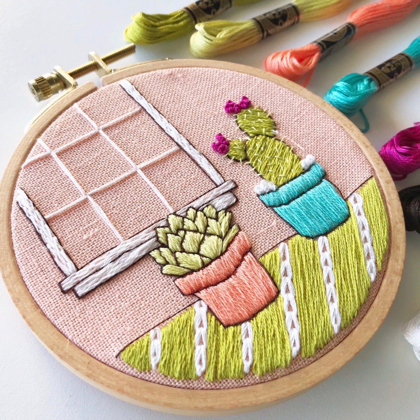 Cozy Cactus PDF includes pattern for image transfer and 11 page booklet with easy to follow directions to complete. Two cute cactus sit in front of a window.