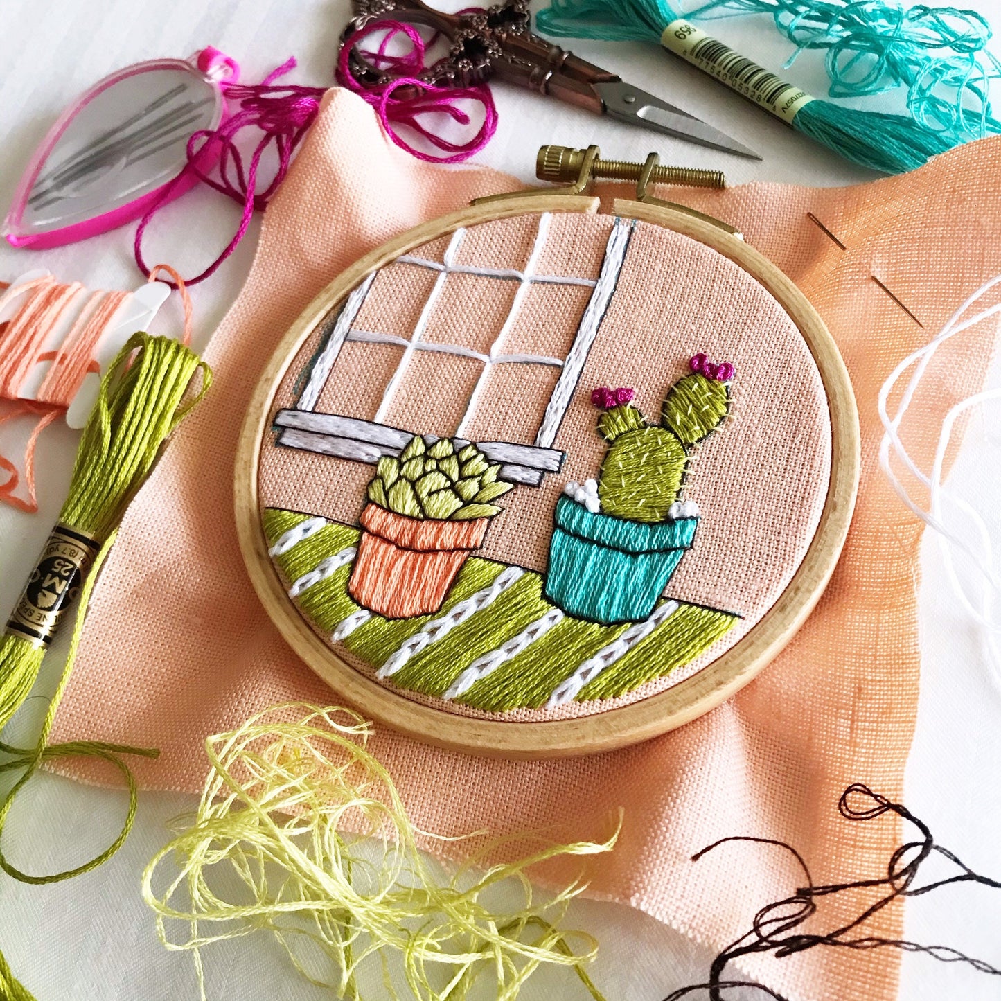 Cozy Cactus PDF includes pattern for image transfer and 11 page booklet with easy to follow directions to complete. Two cute cactus sit in front of a window.