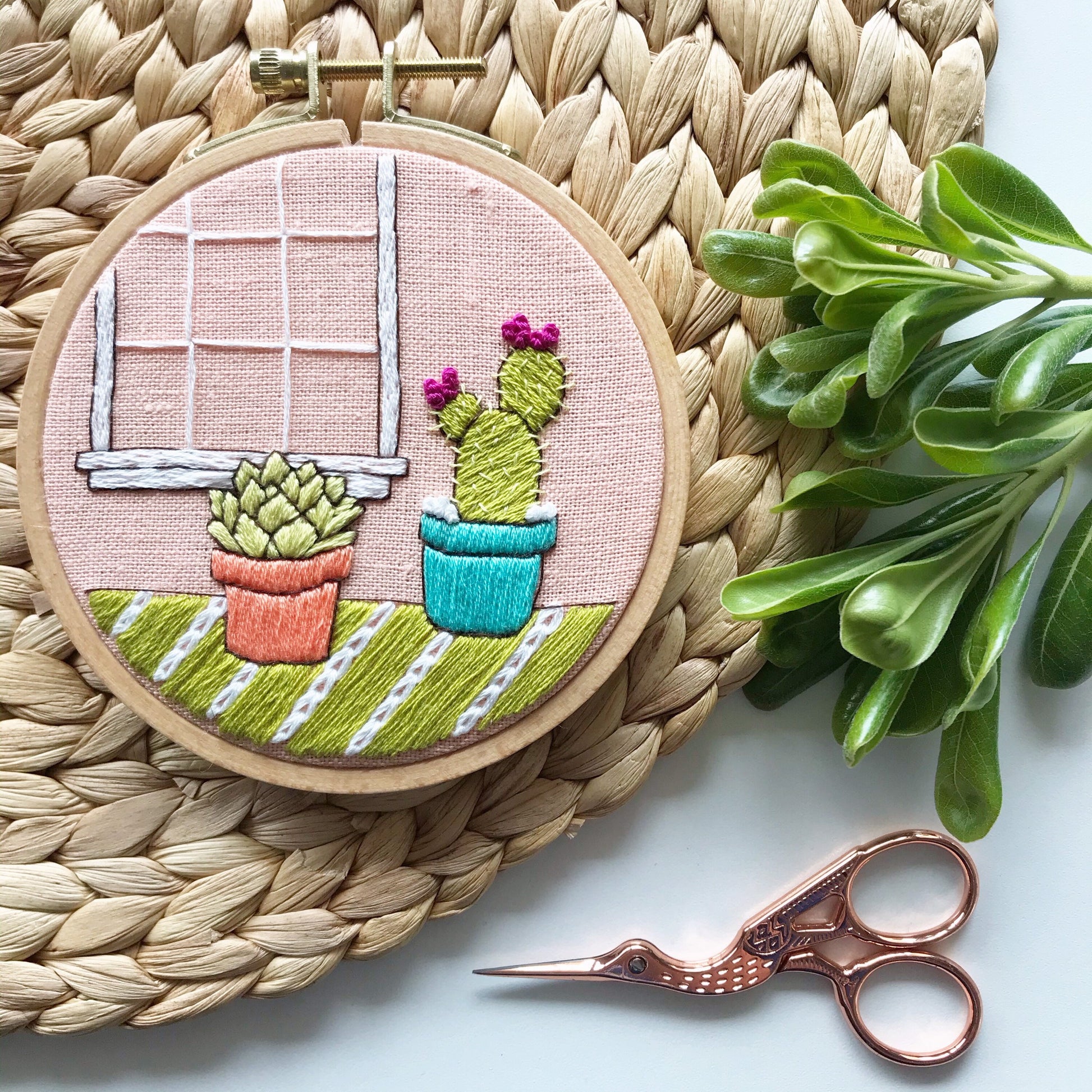 Cozy Cactus PDF includes pattern for image transfer and 11 page booklet with easy to follow directions to complete. Two cute cactus sit in front of a window.