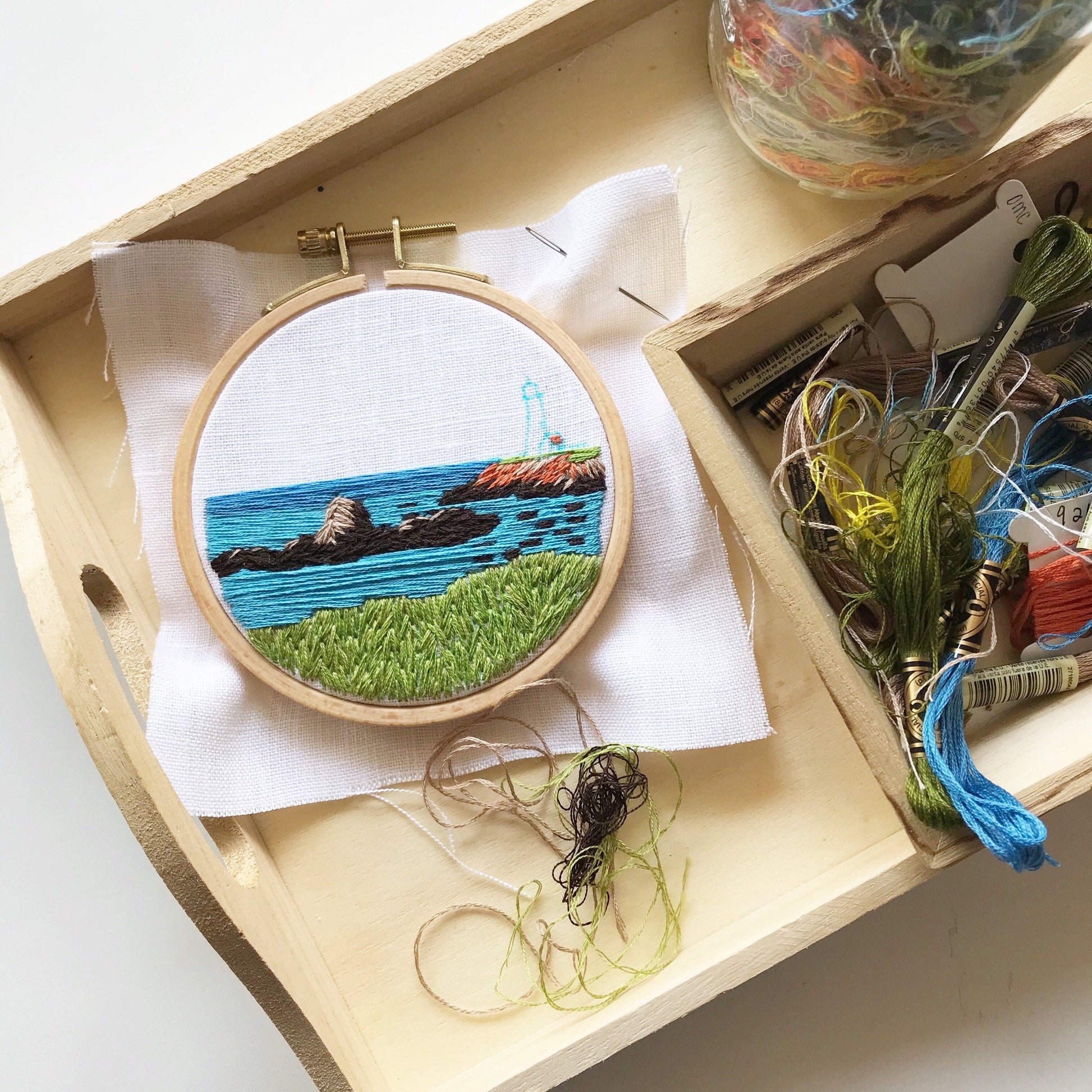 You will need: 4 inch wooden hoop, 6 inch square linen fabric, water soluble pen, 6 strand embroidery floss, needle, felt for backing, pattern, step-by-step instructions