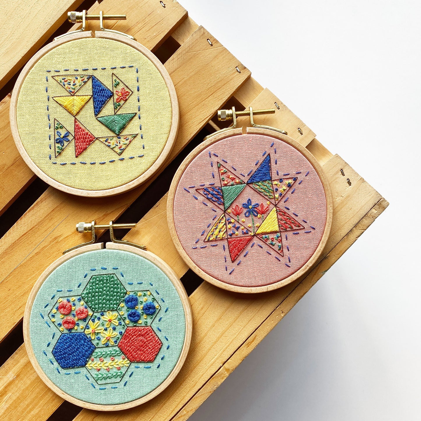 Rosanna Diggs Embroidery Modern Quilt Samplers include: Hexie Harmony, Seeing Starflowers, and Triangle Tango.