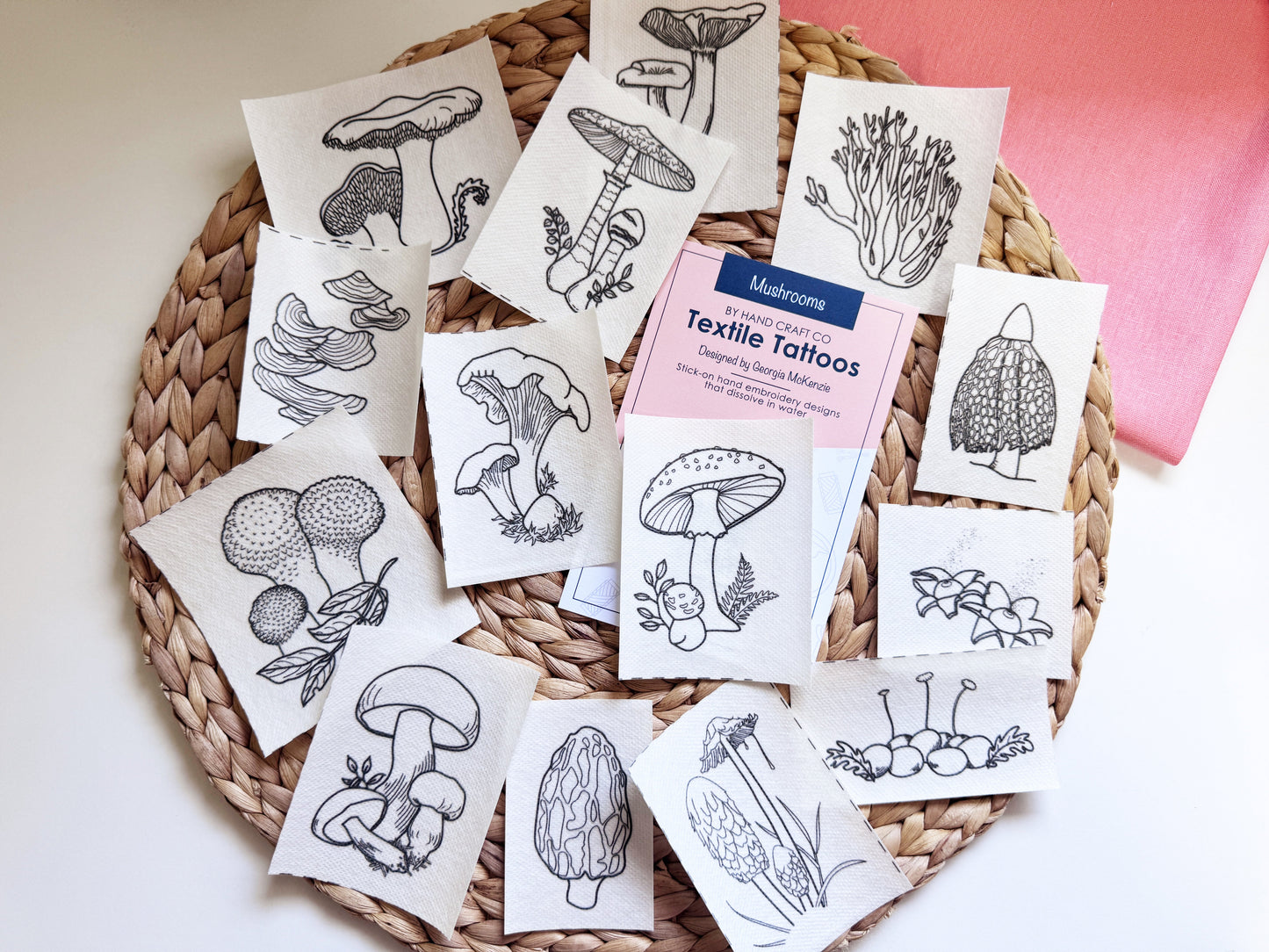 Textile tattoo patterns laid out - mushrooms with black and white designs.