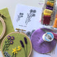 You will need hoop, fabric, water transfer marker, embroidery thread, scissors, and needle.  Two sizes of flowers are printed for every month.  Design to fit your recipient.