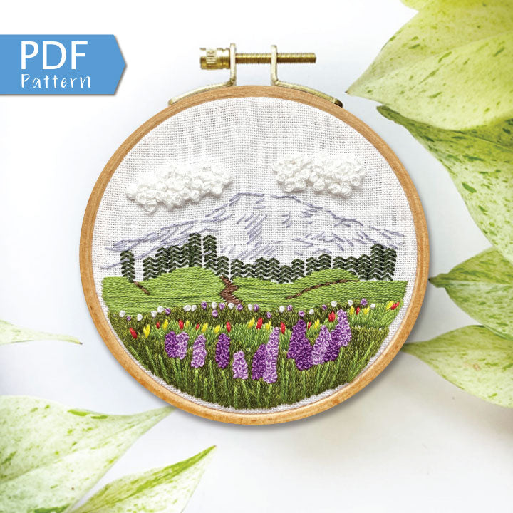 Mount Rainier Embroidery PDF.  Includes pattern for image transfer and 14 page booklet of easy to follow directions to complete.  Image has Mt Rainier in back with lupine and other small flowers in the foreground.