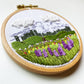 Mount Rainier Embroidery PDF.  Includes pattern for image transfer and 14 page booklet of easy to follow directions to complete.  Image has Mt Rainier in back with lupine and other small flowers in the foreground.
