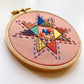 Completed Seeing Starflowers kit. Detail photo of stitches taught within the kit.