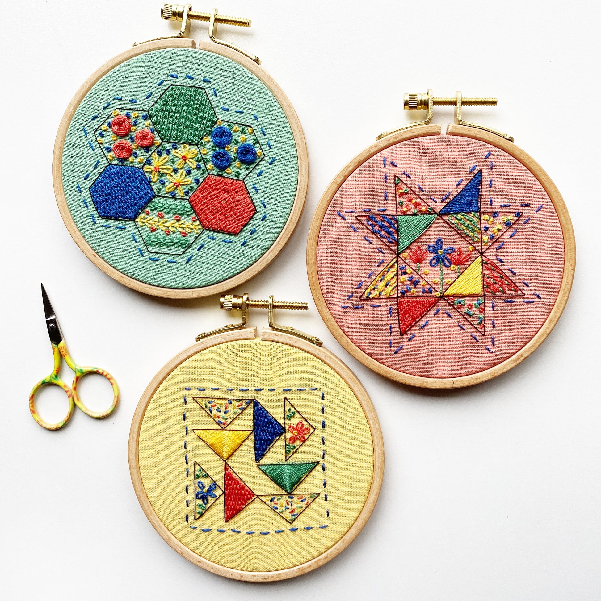 Rosanna Diggs Embroidery Hexie Harmony PDF.  Design features a modern take on the traditional paper pieced hexagon quilt pattern. Part of the RDE Modern Quilt Sampler collection including Seeing Starflowers and Triangle Tango,